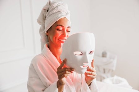 beautiful-young-woman-getting-a-led-light-therapy-mask-treatment-for-her-face-at-the-beauty-salon-min-2048x1366